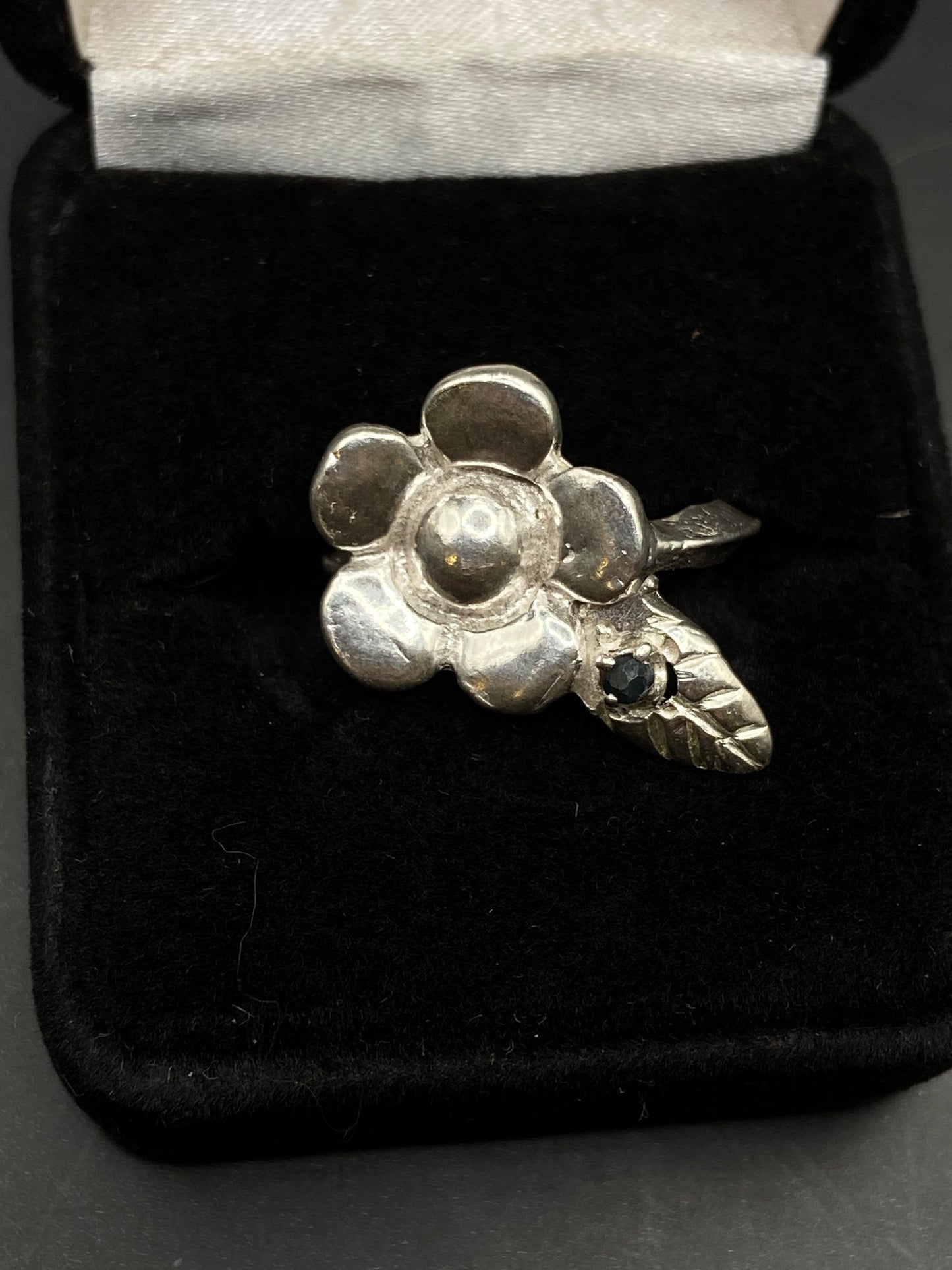 Silver flower and sapphire ring