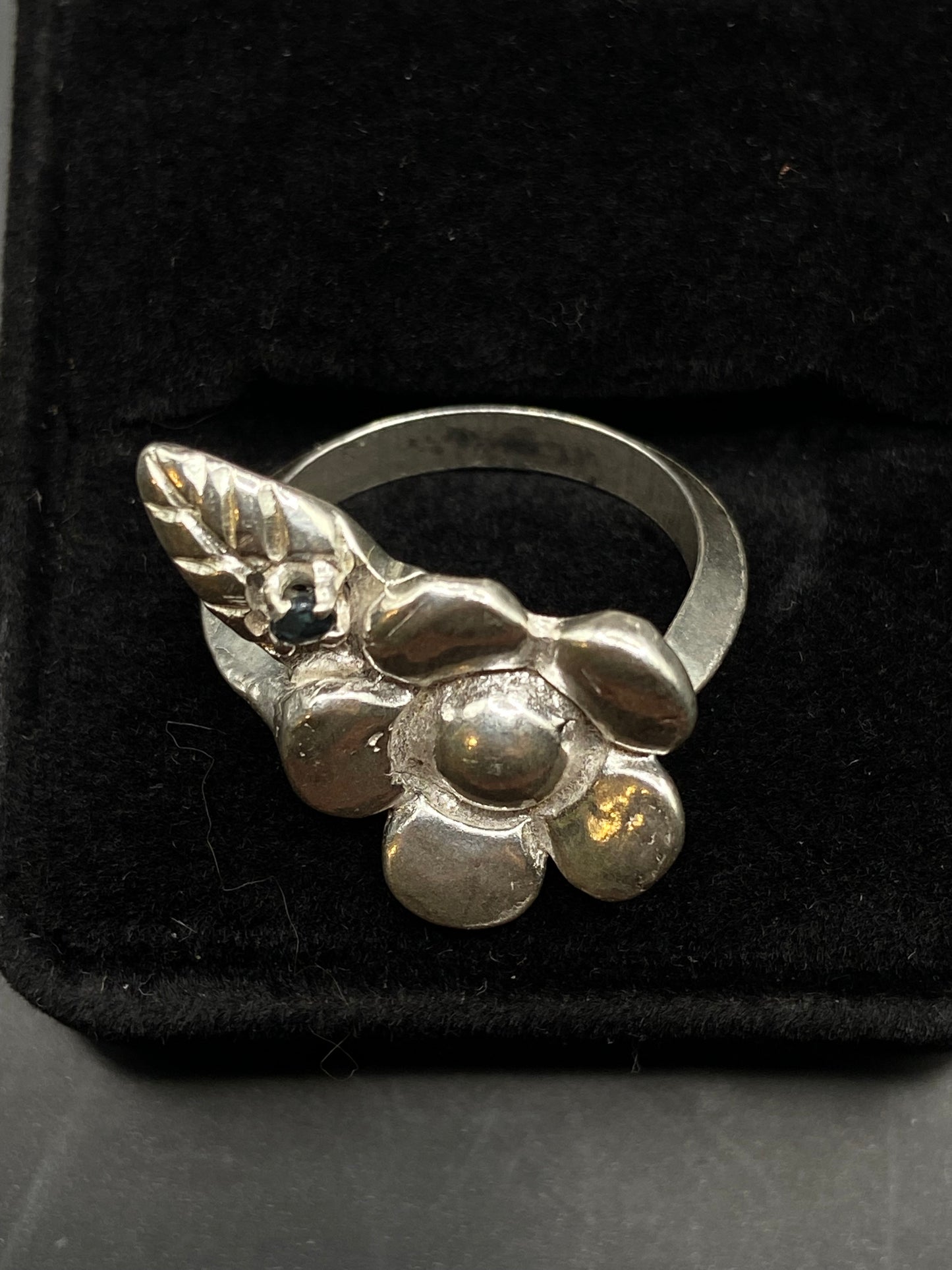 Silver flower and sapphire ring